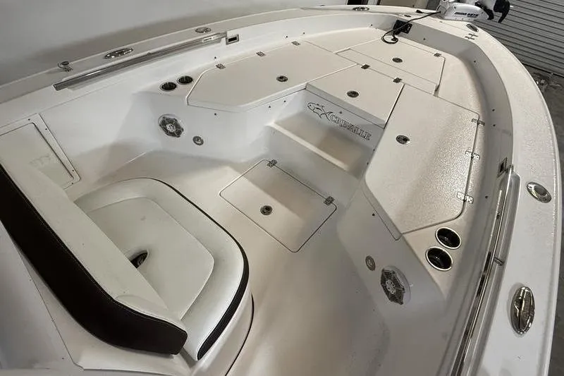 Slide: The Image of 2017 Crevalle 26 HCO boat interior with seating and storage compartments. - 17