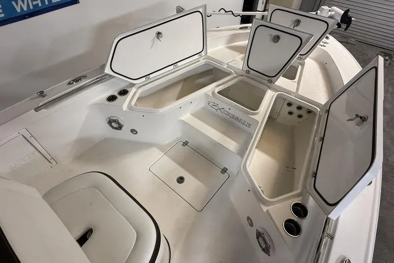 Slide: The Image of 2017 Crevalle 26 HCO boat interior with open storage compartments. - 18