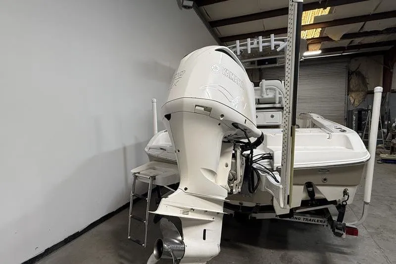 Slide: The Image of 2017 Crevalle 26 HCO boat with Yamaha outboard motor in a garage setting. - 4