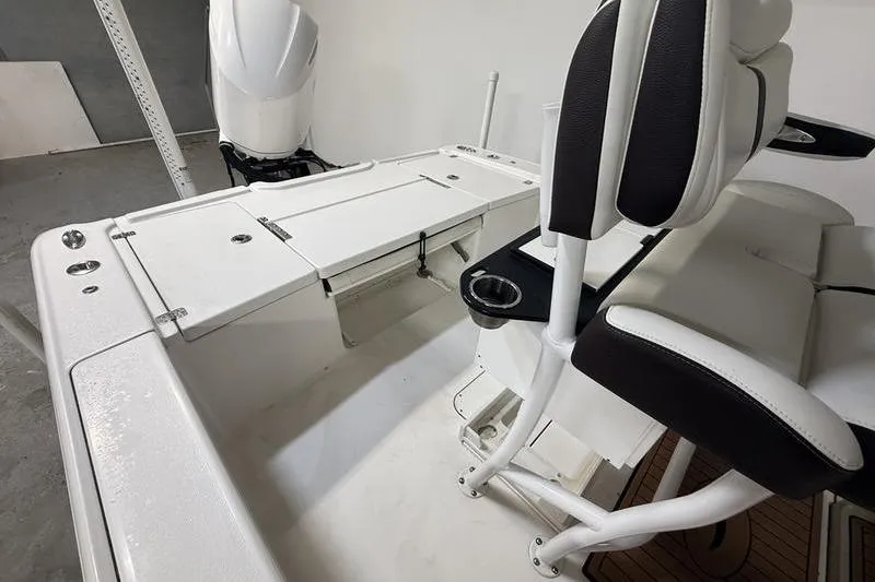 Slide: The Image of 2017 Crevalle 26 HCO boat interior with seating and storage compartments. - 5