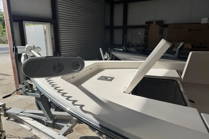 Slide: The Image of 2011 Pathfinder 2200 Tournament Edition boat in storage, featuring open compartments. - 10