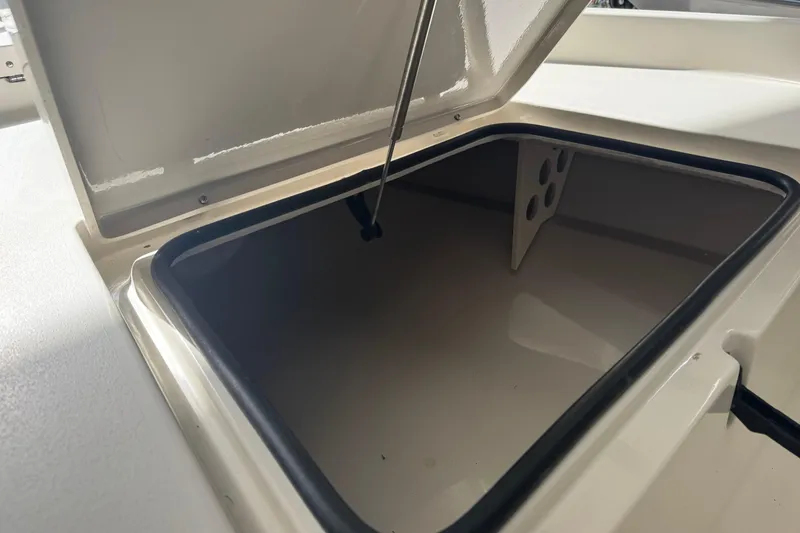 Slide: The Image of Open storage compartment on 2011 Pathfinder 2200 Tournament Edition boat. - 11