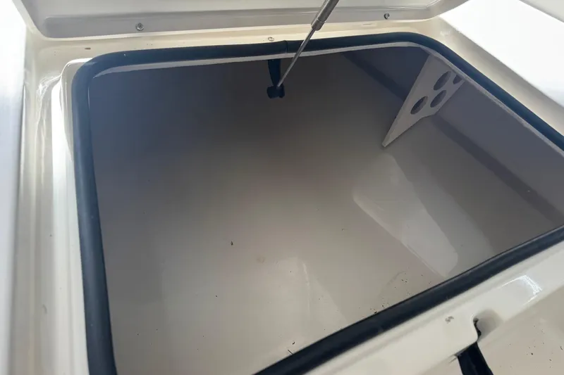 Slide: The Image of Open storage compartment of 2011 Pathfinder 2200 Tournament Edition boat. - 14