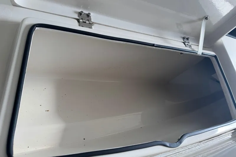 Slide: The Image of Open storage compartment on a 2011 Pathfinder 2200 Tournament Edition boat. - 15
