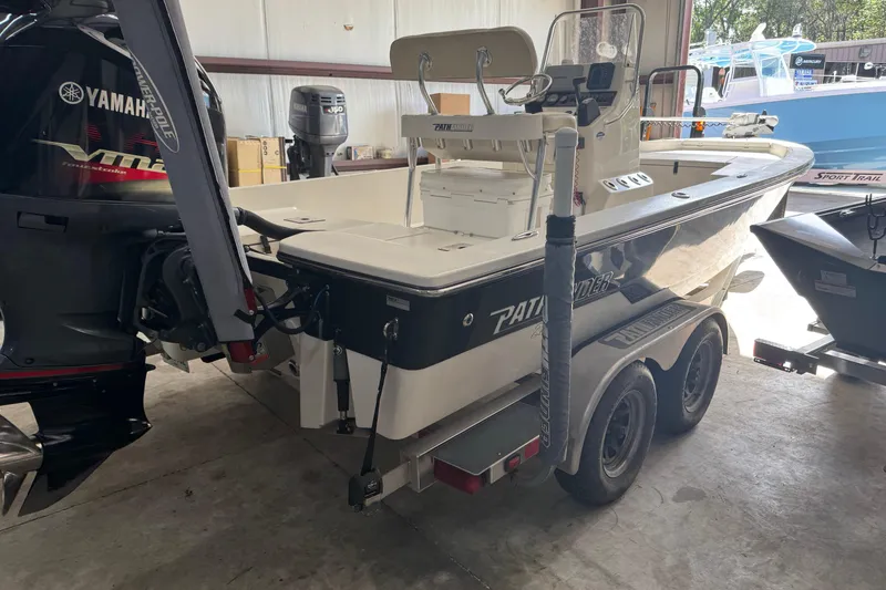 Slide: The Image of 2011 Pathfinder 2200 Tournament Edition boat on trailer in garage setting. - 2