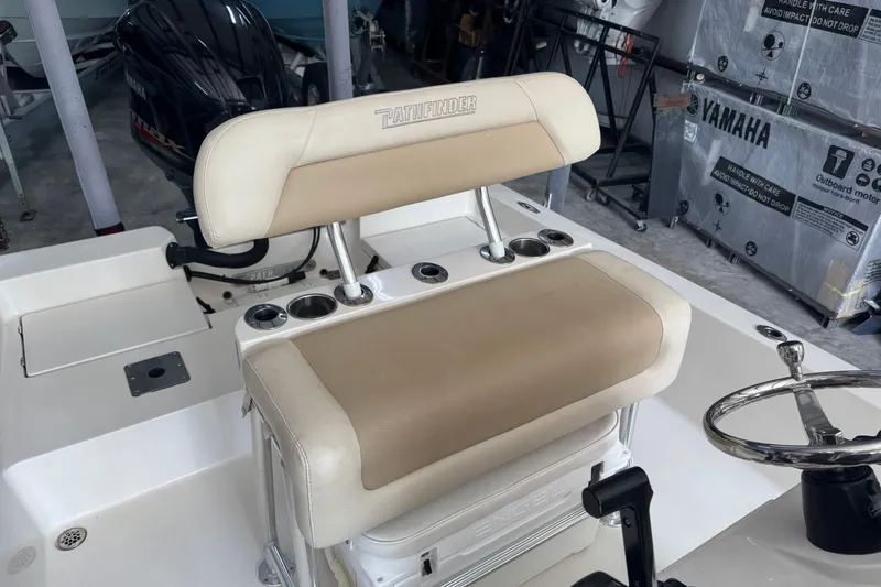Slide: The Image of 2011 Pathfinder 2200 Tournament Edition boat interior with seating and Yamaha engine. - 20