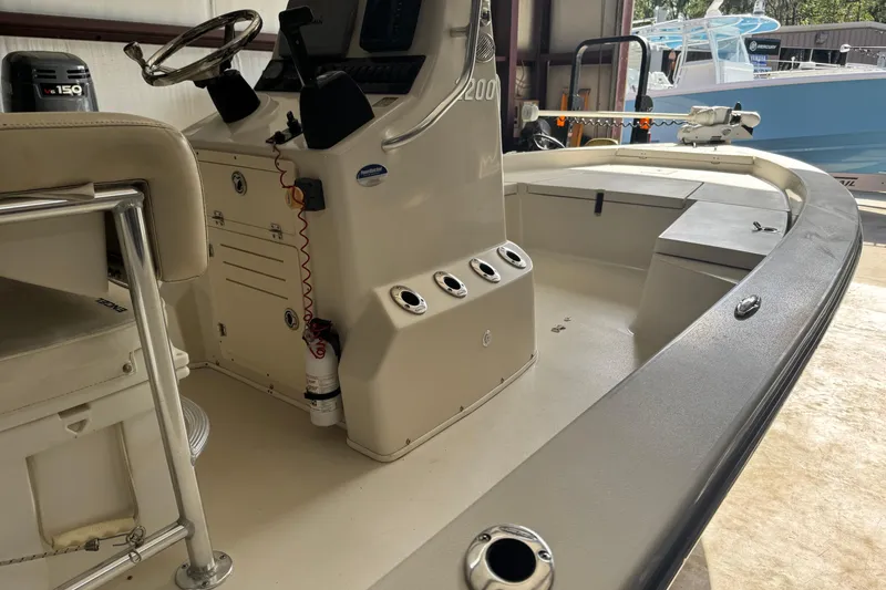 Slide: The Image of 2011 Pathfinder 2200 Tournament Edition boat interior with steering console and seating. - 3