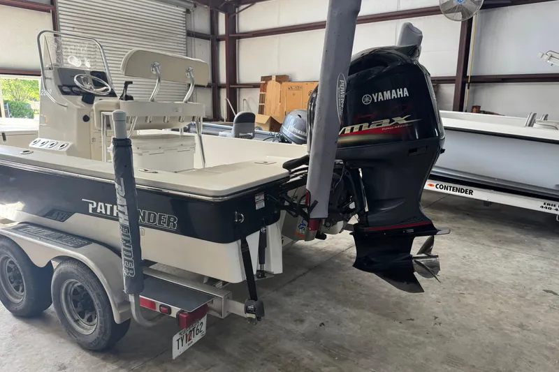 Slide: The Image of 2011 Pathfinder 2200 Tournament Edition boat with Yamaha engine in a garage. - 6