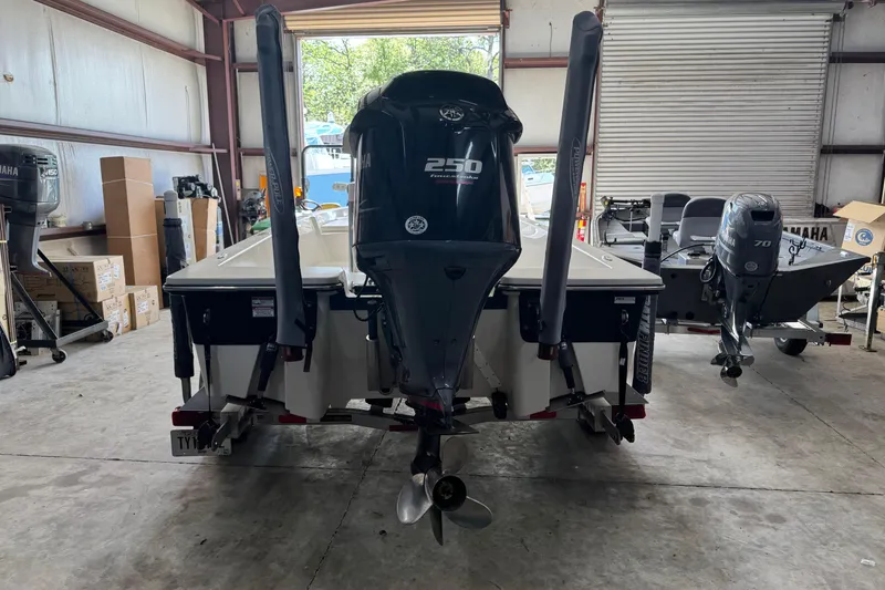 Slide: The Image of 2011 Pathfinder 2200 Tournament Edition boat with Yamaha 250 engine in a garage. - 7