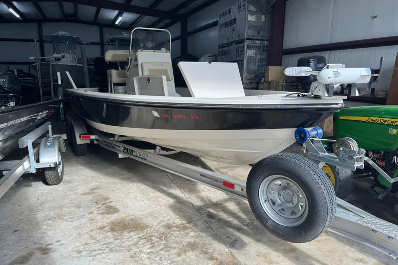 Slide: The Image of 2011 Pathfinder 2200 Tournament Edition boat on trailer in storage facility. - 8