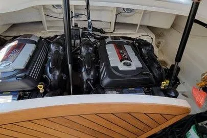 Slide: The Image of 2017 Sea Ray SLX 310 boat engines with open engine compartment. - 16