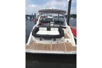 Slide: The Image of 2017 Sea Ray SLX 310 boat docked on a sunny day. - 4