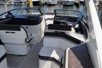 Slide: The Image of 2017 Sea Ray SLX 310 boat interior with luxurious seating and modern dashboard. - 8