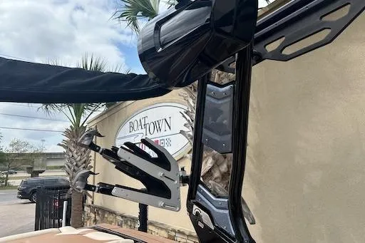 Slide: The Image of 2024 Supreme S220 boat with sleek black tower and wakeboard racks at Boat Town. - 17
