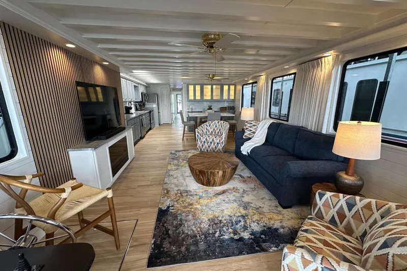 Slide: The Image of Luxurious interior of a 1998 Stardust Cruisers 16x84 houseboat with modern furnishings. - 2