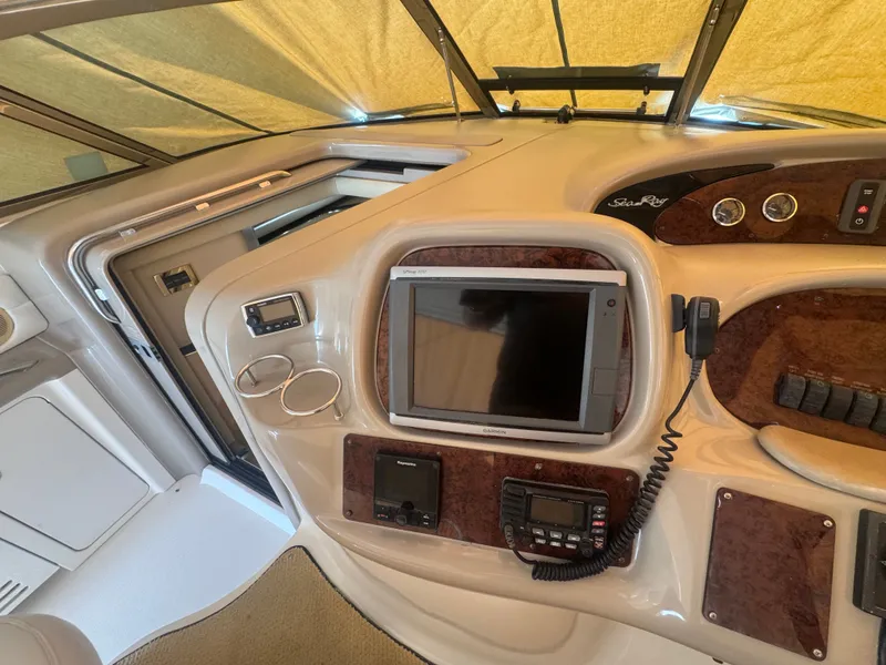 Slide: The Image of Interior view of 1999 Sea Ray 380 Sundancer cockpit with navigation system. - 10