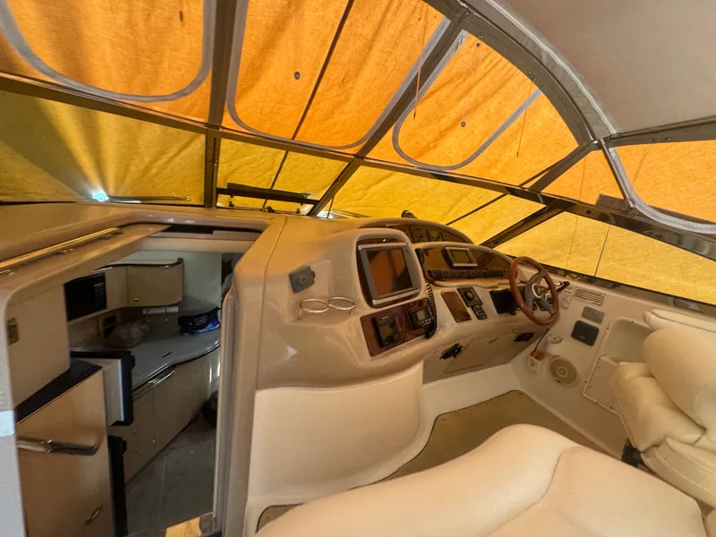 Slide: The Image of Interior of 1999 Sea Ray 380 Sundancer with cockpit and helm area. - 15