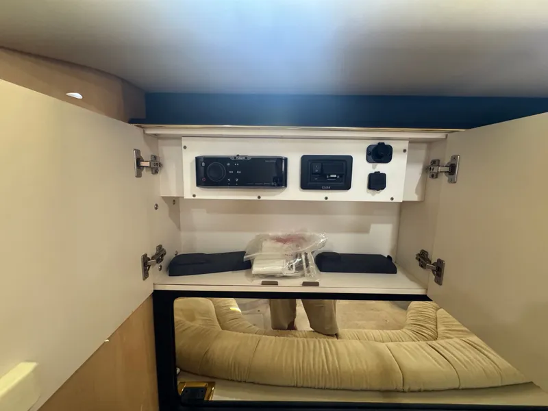 Slide: The Image of Interior of 1999 Sea Ray 380 Sundancer with electronics compartment. - 18