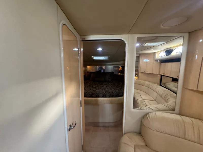 Slide: The Image of Interior of 1999 Sea Ray 380 Sundancer featuring cozy bedroom. - 21