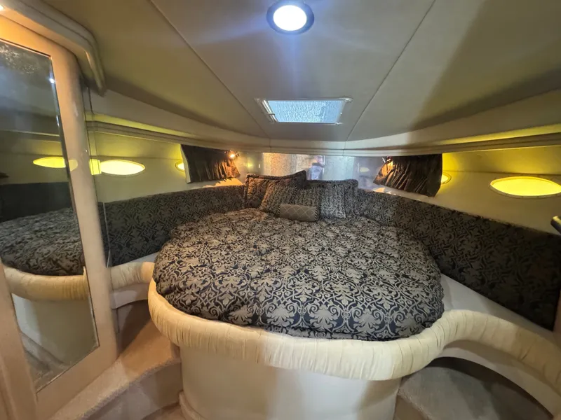 Slide: The Image of Interior of 1999 Sea Ray 380 Sundancer with luxurious bed. - 22