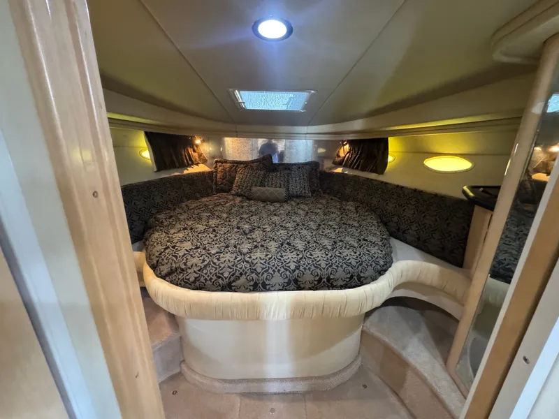 Slide: The Image of Luxurious cabin of 1999 Sea Ray 380 Sundancer with elegant bedding. - 23