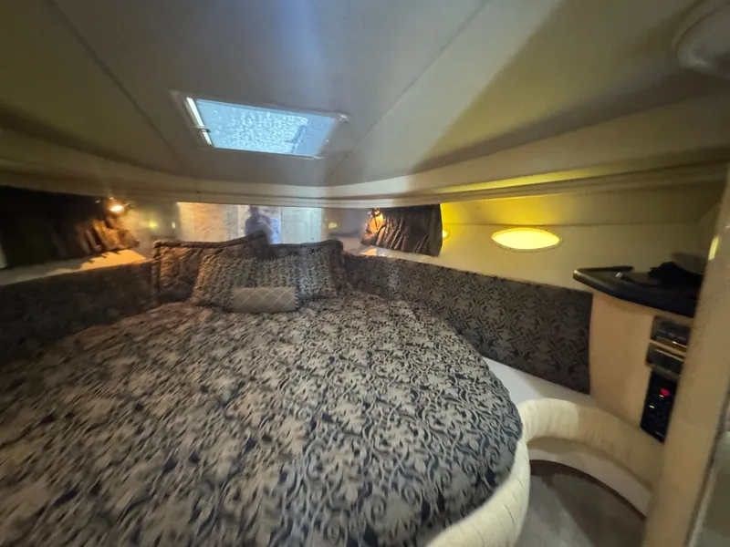Slide: The Image of Interior of 1999 Sea Ray 380 Sundancer with luxurious bed. - 25