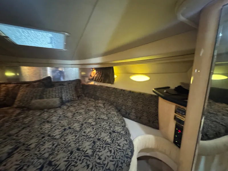 Slide: The Image of Interior of 1999 Sea Ray 380 Sundancer with cozy bed. - 26