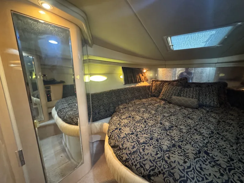 Slide: The Image of Luxurious cabin of 1999 Sea Ray 380 Sundancer with elegant bedding. - 28