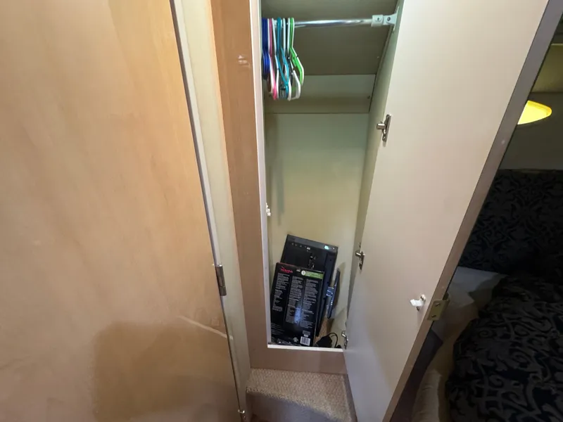 Slide: The Image of Open closet in Sea Ray 380 Sundancer 1999 boat. - 31