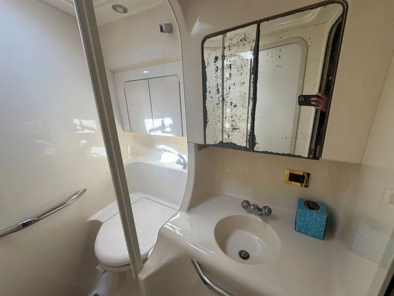 Slide: The Image of 1999 Sea Ray 380 Sundancer bathroom with mirror and sink. - 34