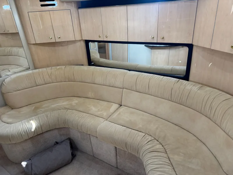 Slide: The Image of Interior of 1999 Sea Ray 380 Sundancer with beige sofa. - 36