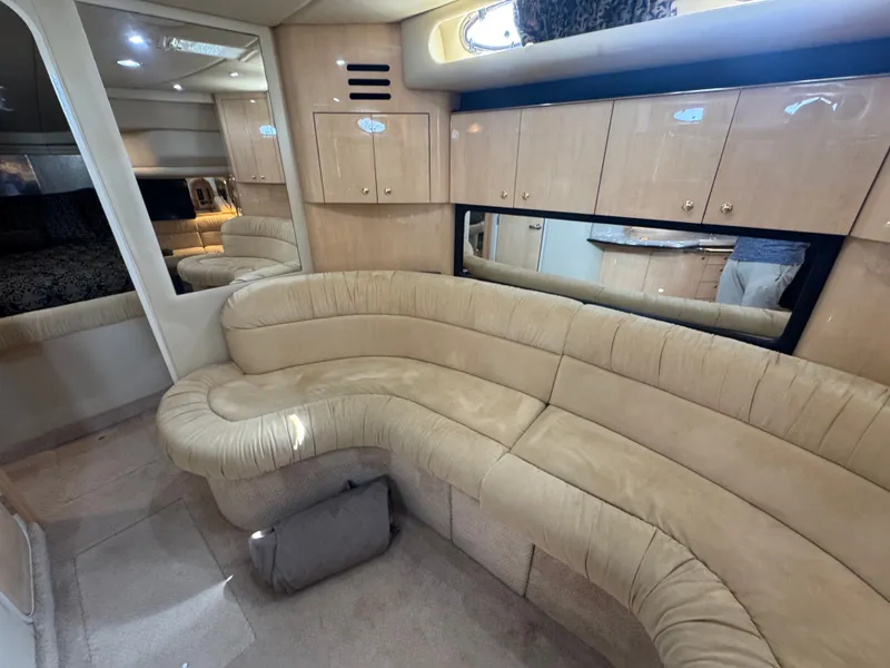 Slide: The Image of Interior of 1999 Sea Ray 380 Sundancer with beige sofa. - 39