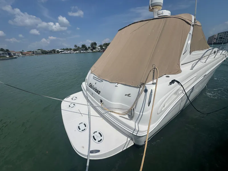 Slide: The Image of 1999 Sea Ray 380 Sundancer boat on water. - 5