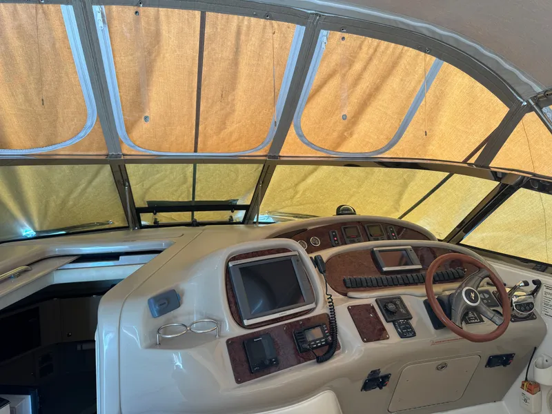Slide: The Image of Interior view of a 1999 Sea Ray 380 Sundancer yacht cockpit. - 7