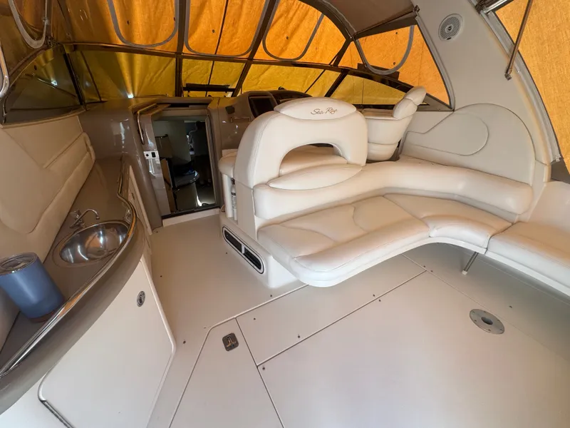 Slide: The Image of Interior of a 1999 Sea Ray 380 Sundancer with beige leather and sink. - 8