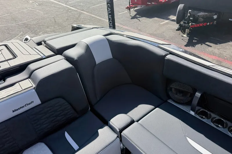 Slide: The Image of 2024 MasterCraft X24 boat interior with sleek seating and modern design. - 18