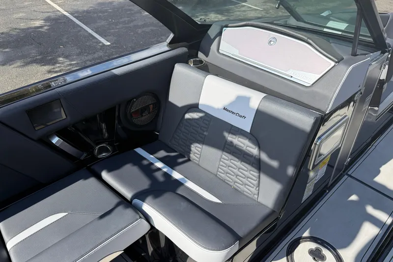 Slide: The Image of 2024 MasterCraft X24 boat interior with sleek seating and modern design. - 21
