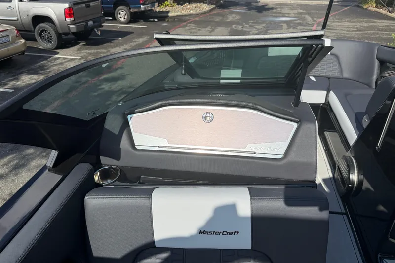 Slide: The Image of 2024 MasterCraft X24 boat interior with sleek seating and modern dashboard design. - 23