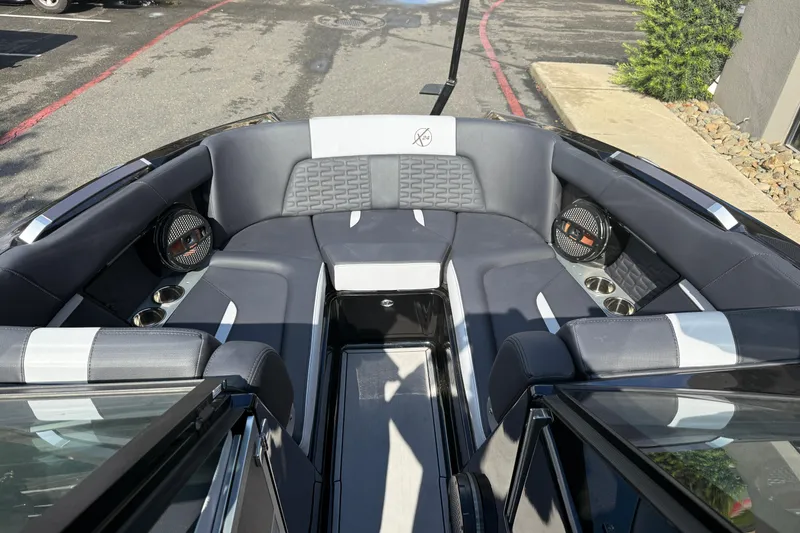 Slide: The Image of 2024 MasterCraft X24 boat interior with luxurious seating and premium audio system. - 24