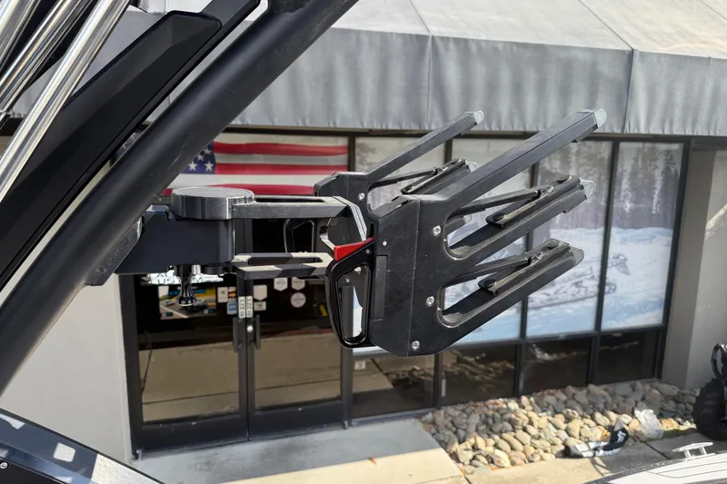 Slide: The Image of 2024 MasterCraft X24 wakeboard rack with American flag in the background. - 27