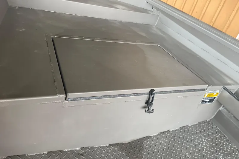 Slide: The Image of Storage compartment on 2026 Reaper Boats 550 Timber Reaper, featuring secure latch and durable design. - 11