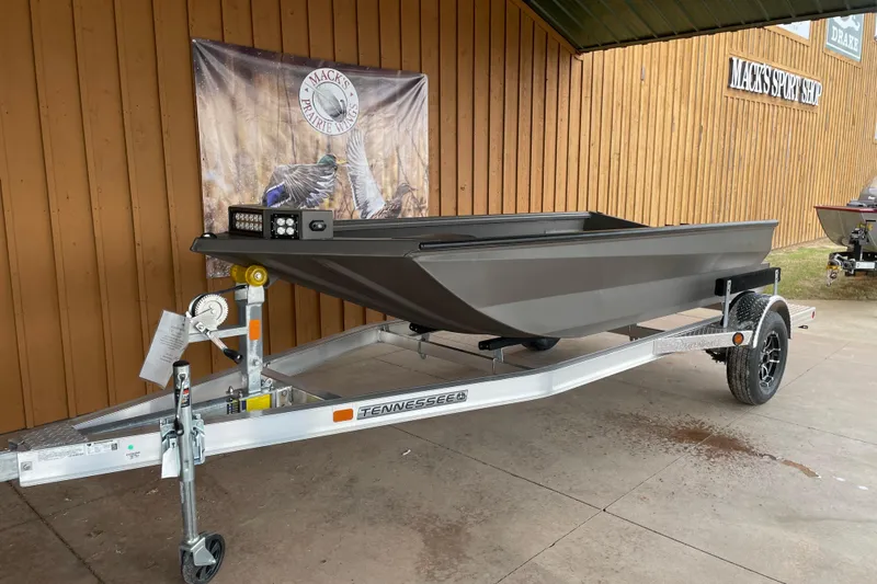 Slide: The Image of 2026 Reaper Boats 550 Timber Reaper on trailer outside Mack's Sport Shop. - 3