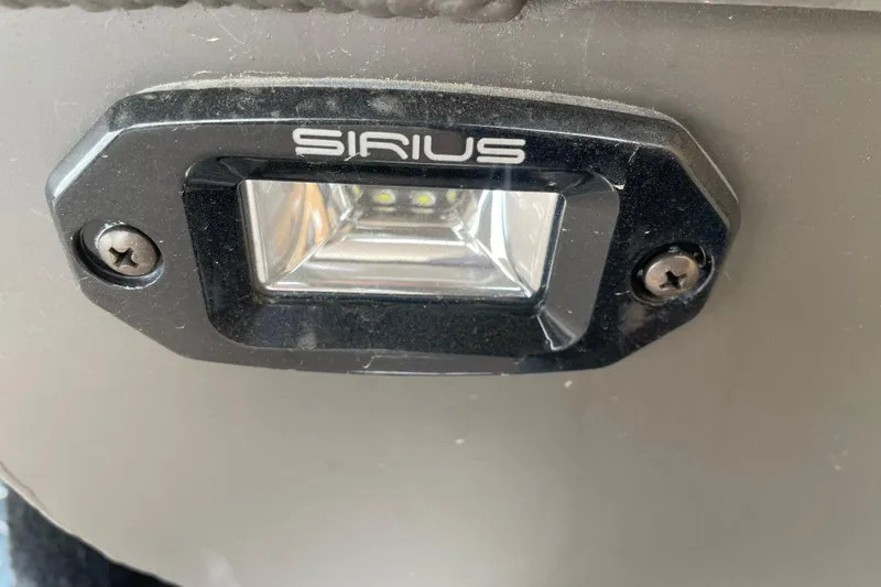 Slide: The Image of Close-up of Sirius light on 2026 Reaper Boats 550 Timber Reaper. - 7