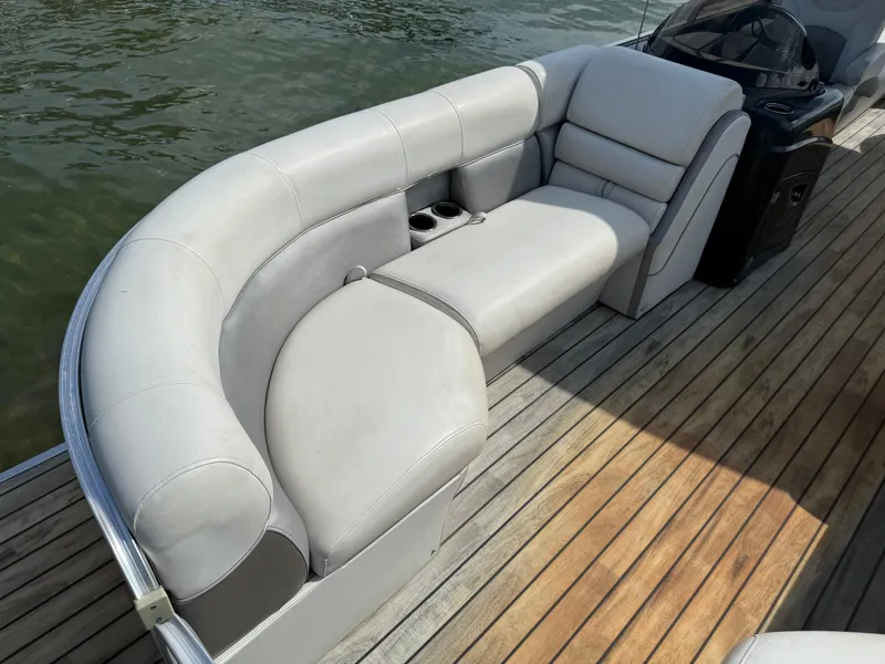 Slide: The Image of Sanpan 25 pontoon boat with gray leather seats, year 2000. - 4