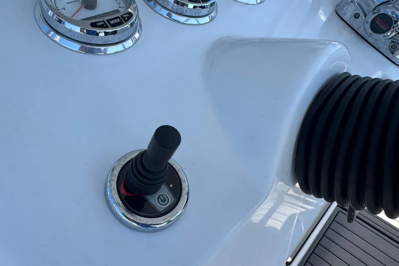 Slide: The Image of Control panel of 2008 Donzi 32 ZF Open boat with joystick and gauges. - 10