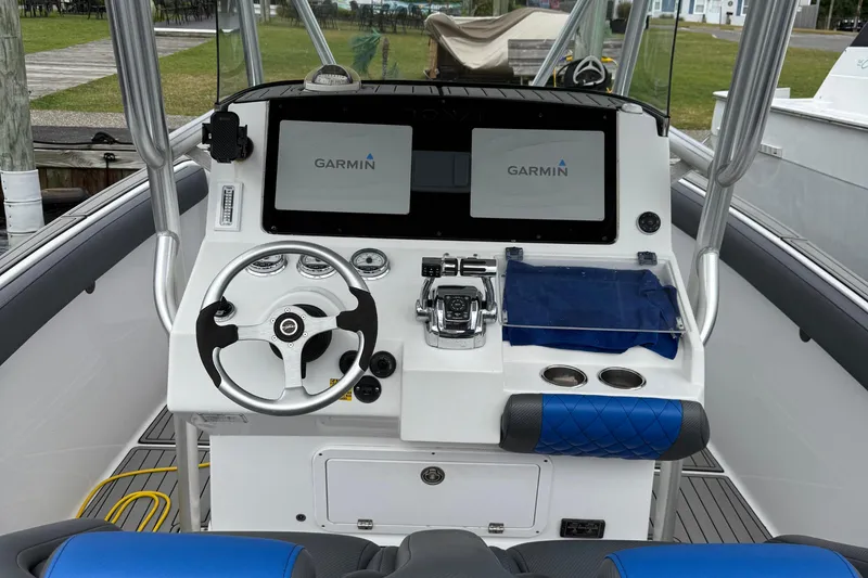 Slide: The Image of 2008 Donzi 32 ZF Open boat dashboard with Garmin navigation system. - 16