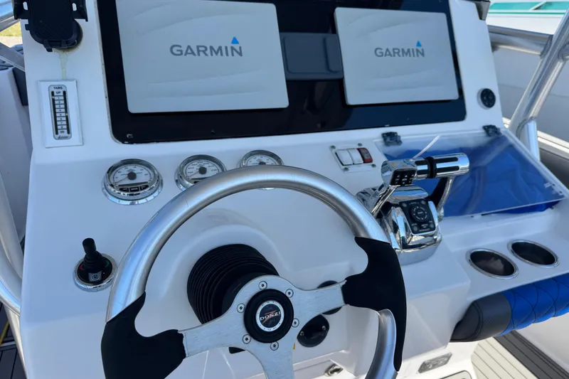 Slide: The Image of Control panel of 2008 Donzi 32 ZF Open with Garmin navigation displays. - 8