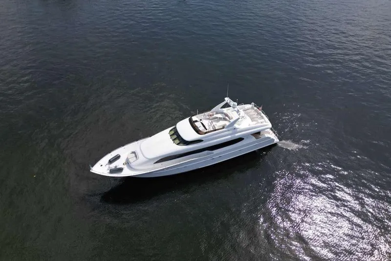 Slide: The Image of Aerial view of a 2001 Lazzara Motoryacht cruising on open water. - 14