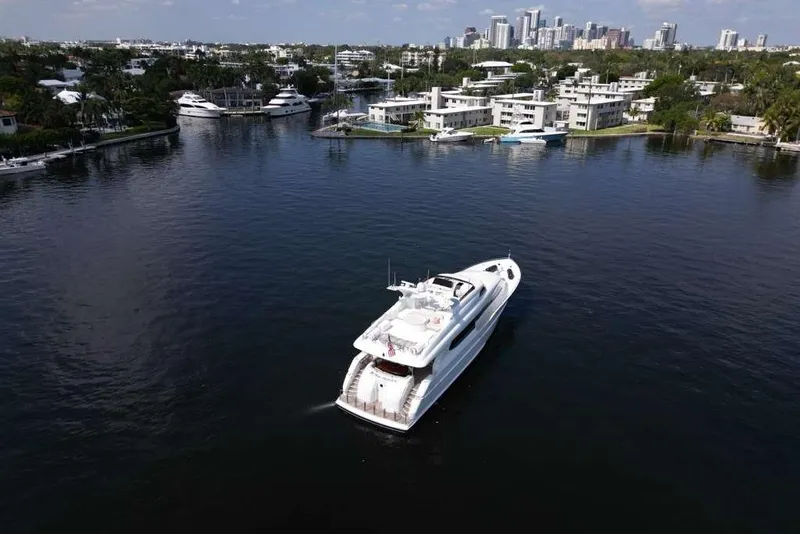 Slide: The Image of 2001 Lazzara Motoryacht cruising in a scenic waterfront area with city skyline. - 19