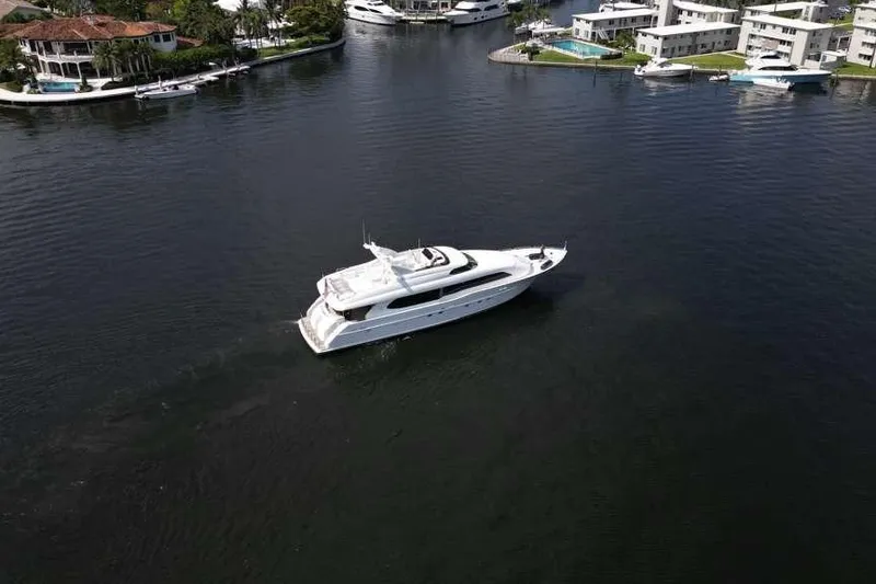 Slide: The Image of Aerial view of a 2001 Lazzara Motoryacht cruising in a residential waterway. - 20